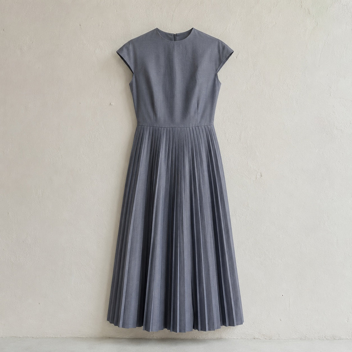 laid flat and shot from above — Slate Hollow knife-pleat midi dress, Pleated Midi Dresses by ORASCI.