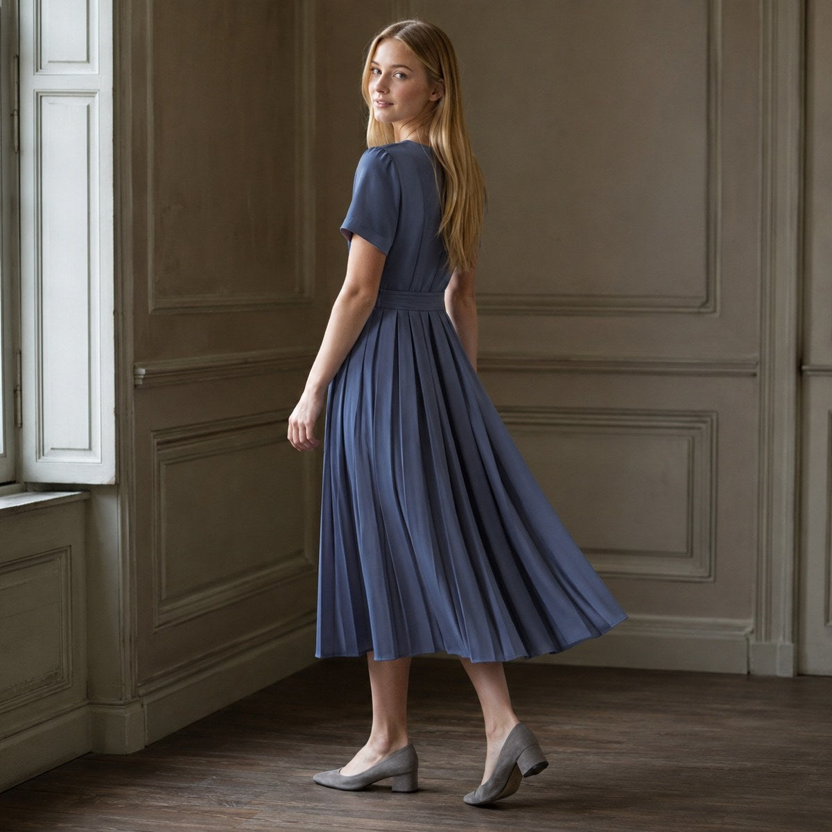 shown worn, from the side — Slate Hollow knife-pleat midi dress, Pleated Midi Dresses by ORASCI.