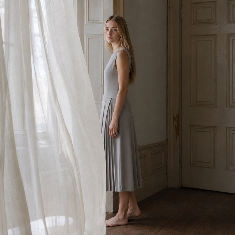 shown on the model — Hazel Court knife-pleat midi dress, Pleated Midi Dresses by ORASCI.