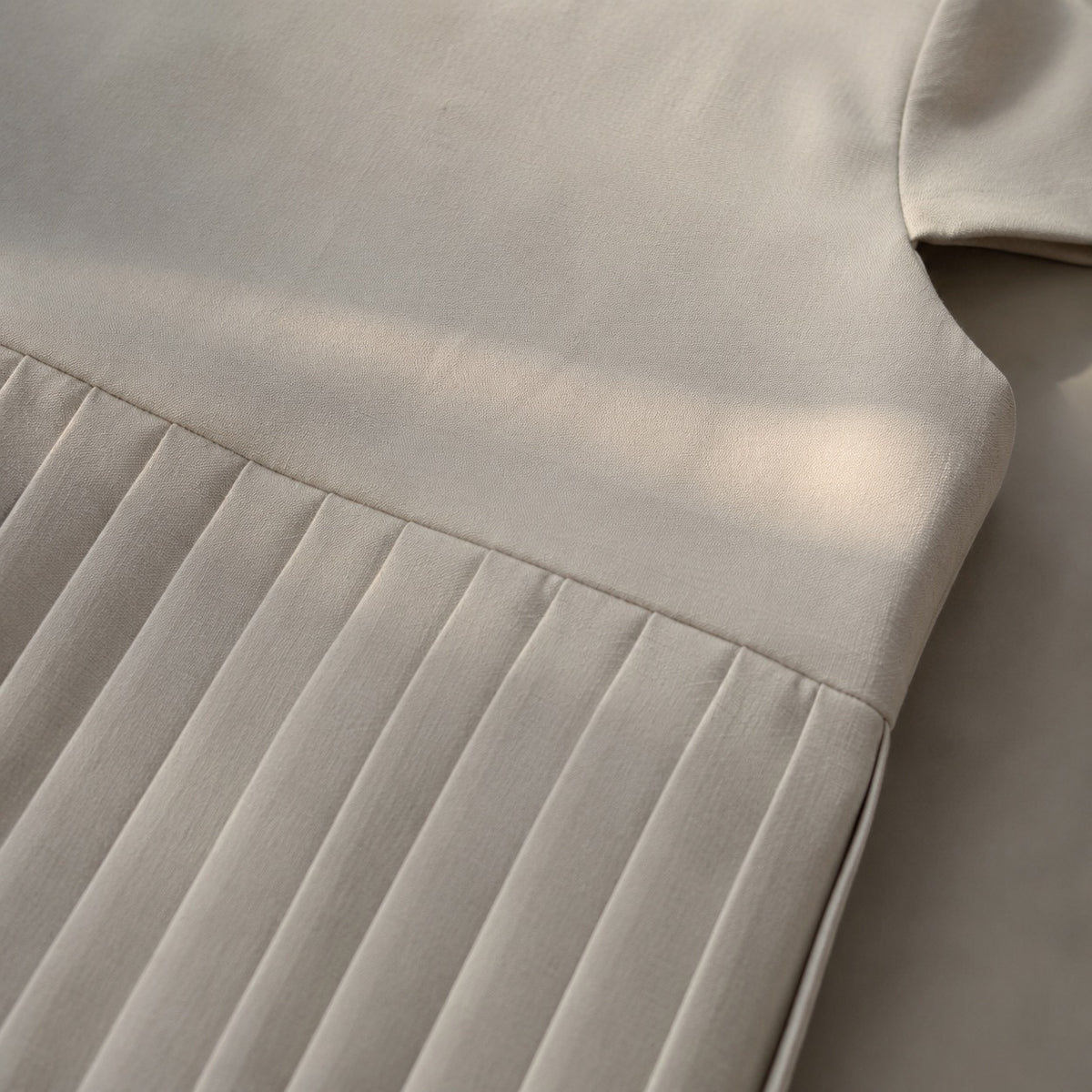 detail shot of the fabric — Cudham knife-pleat midi dress, Pleated Midi Dresses by ORASCI.