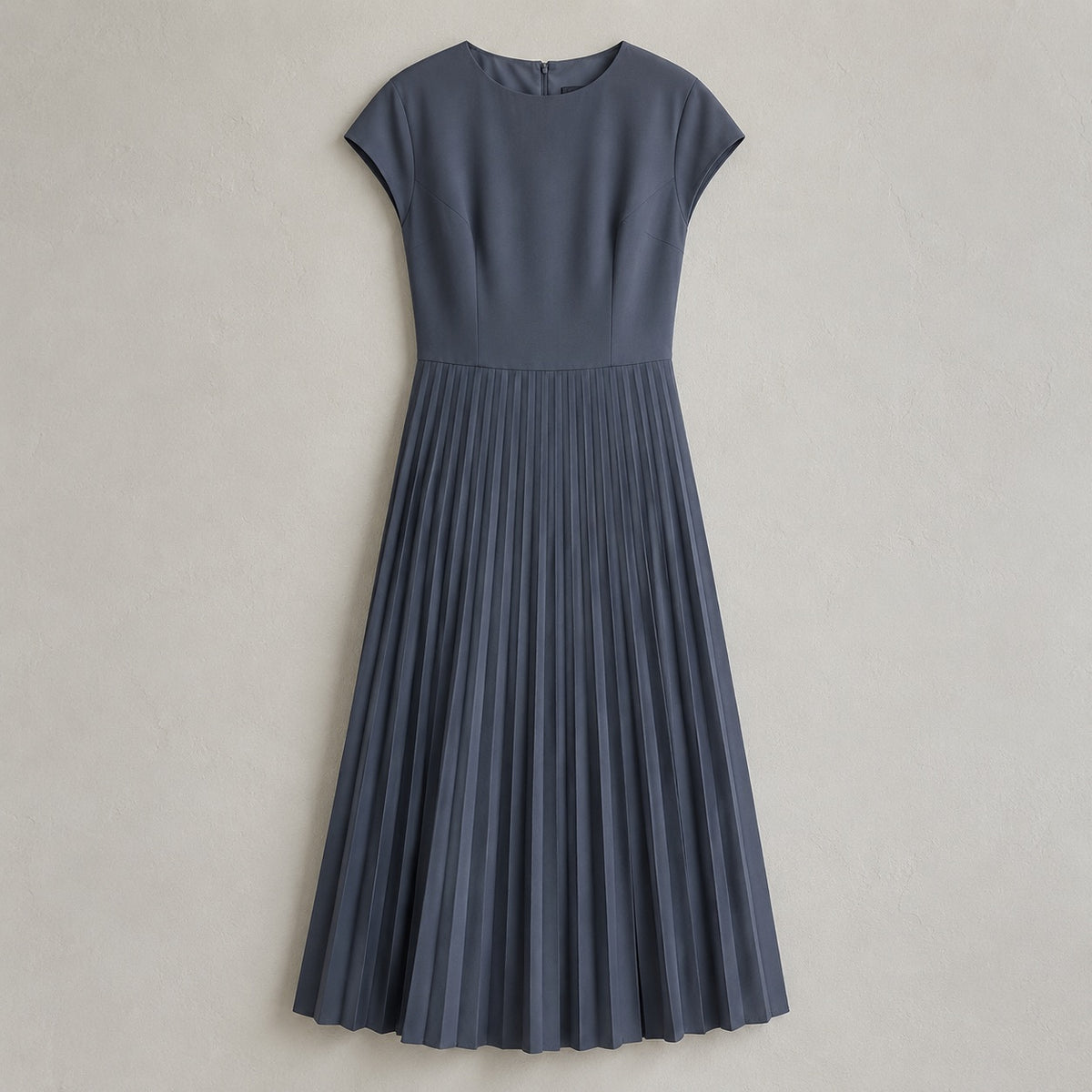 laid flat and shot from above — Cudham knife-pleat midi dress, Pleated Midi Dresses by ORASCI.
