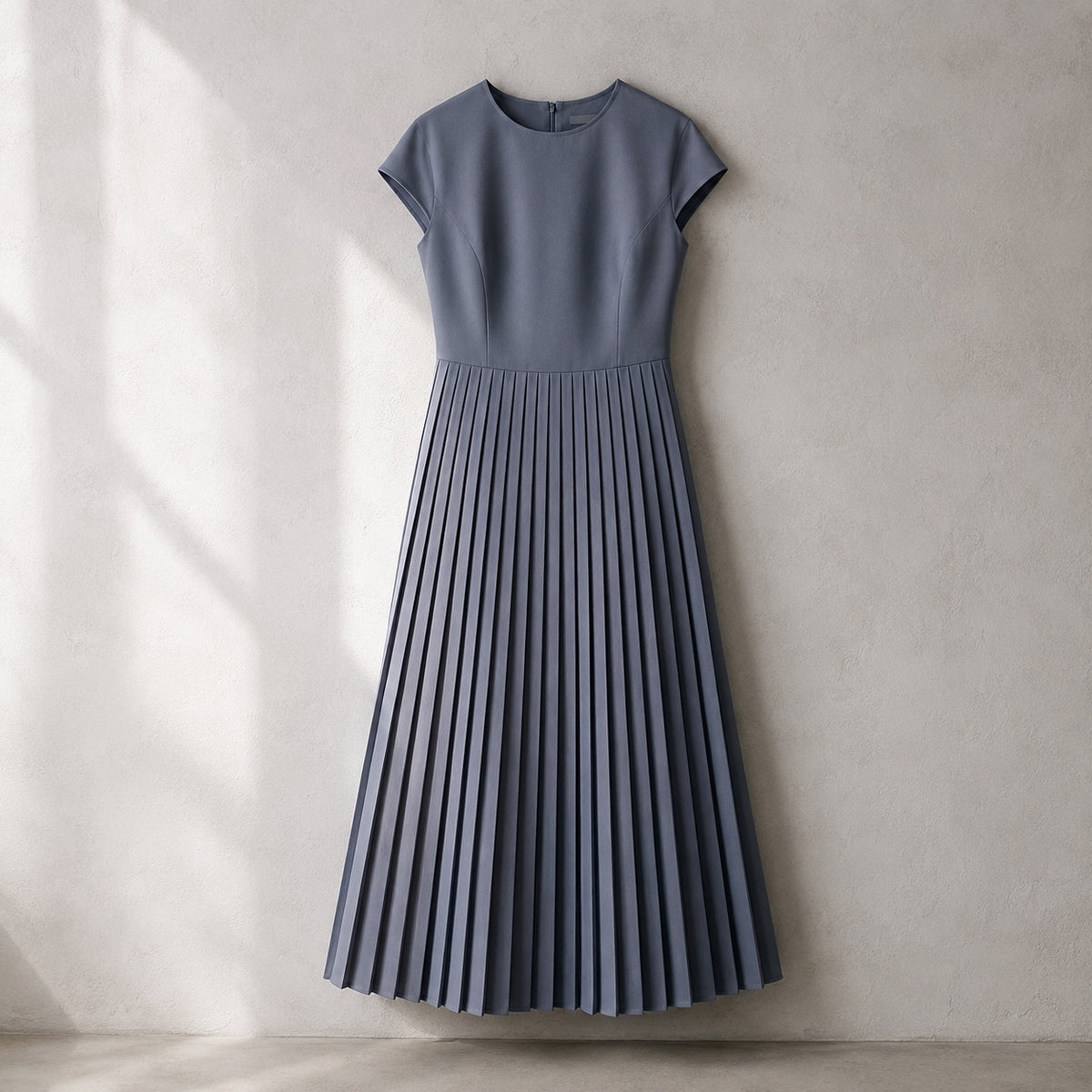 laid flat and shot from above — Linden Row knife-pleat midi dress, Pleated Midi Dresses by ORASCI.